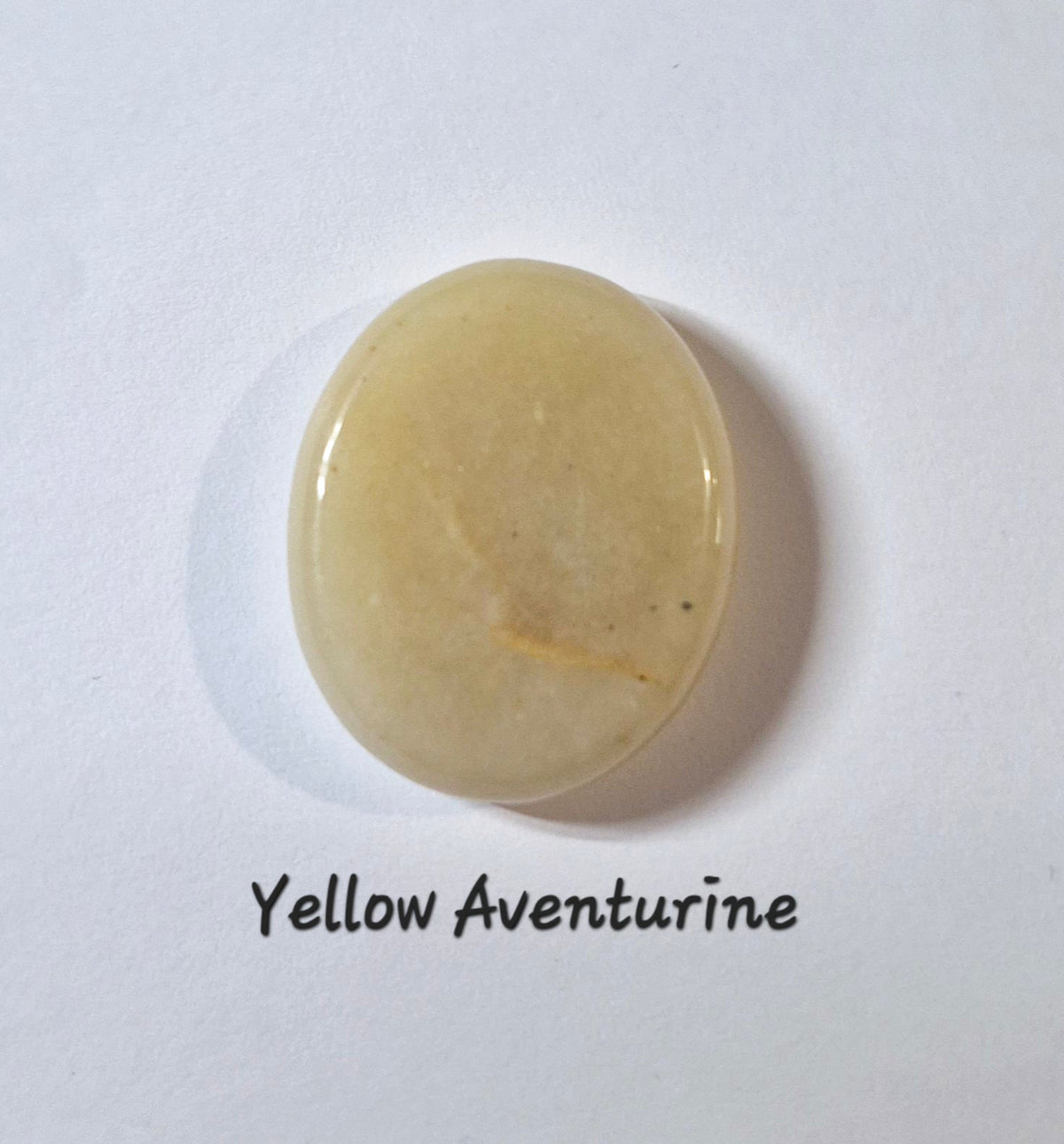 A polished oval worry stone of yellow aventurine stone, displayed on a white background with the text 'Yellow Aventurine' underneath.