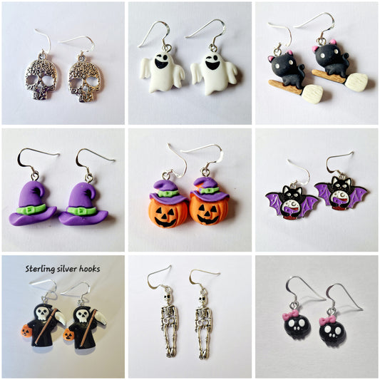 A 3x3 collage showing nine pairs of Halloween-themed dangle earrings on white backgrounds. The designs include silver skull, white ghost, black cat on broom, purple witch hat, orange pumpkin, black bat, skeleton, and black cat with pink bow.